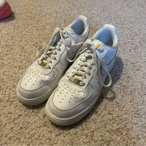 White and gold air force 1s